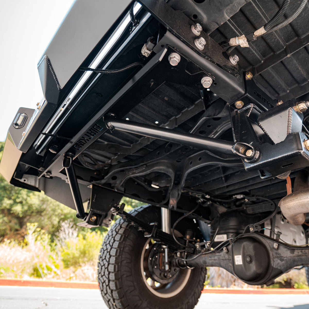Dirt King Tacoma shackle and hanger kit — installed view 1