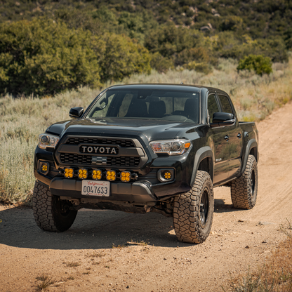 Toyota Tacoma with Dirt King billet upper control arms on trail