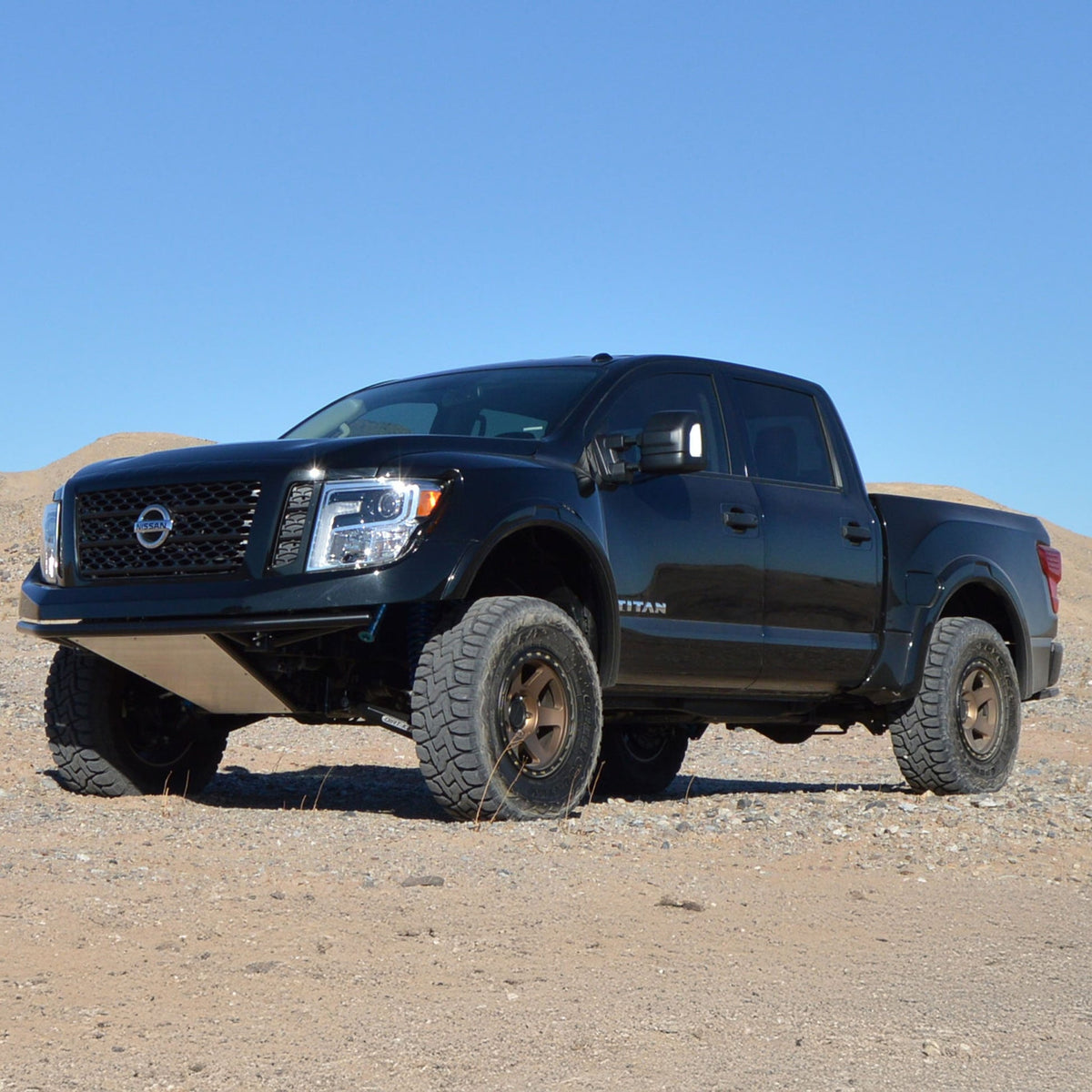 Nissan Titan Dirt King long travel kit in desert