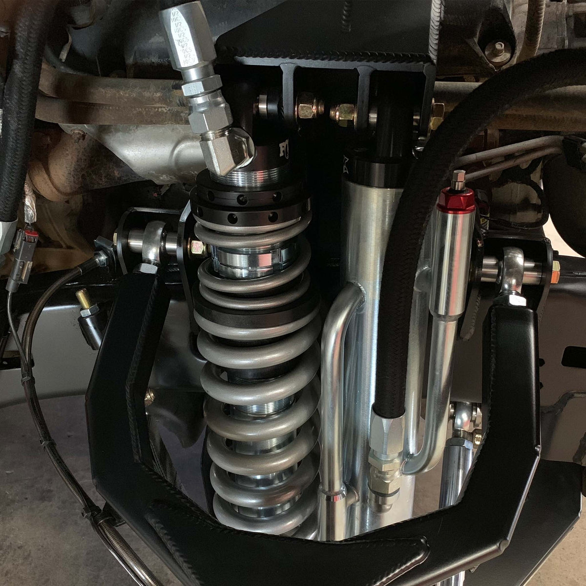 Dirt King Ram 1500 2WD shock towers installed with coilover suspension