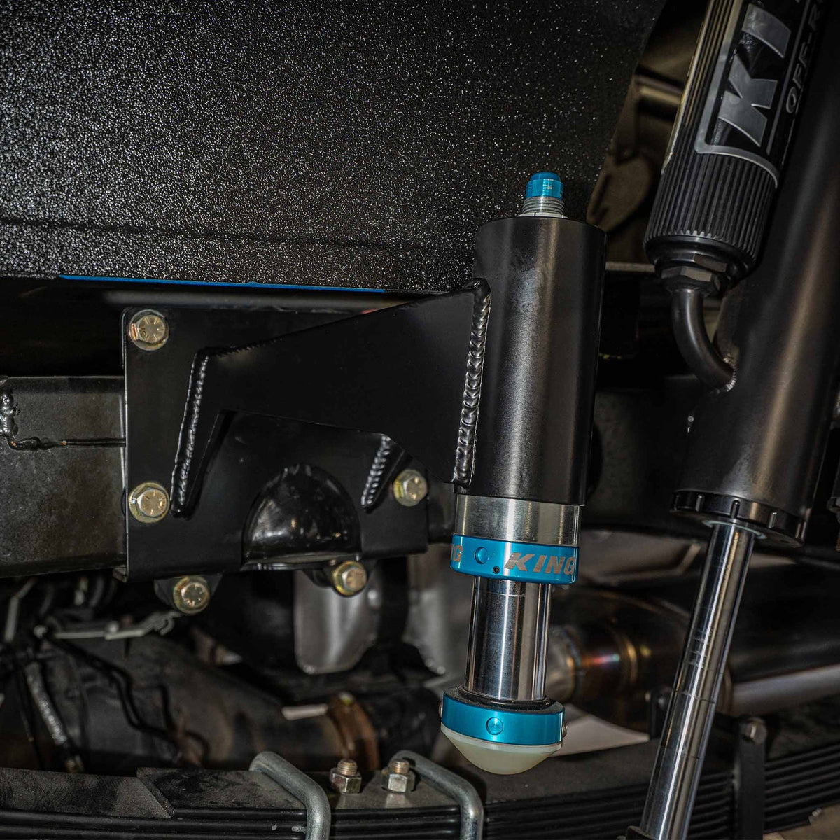 Dirt King bolt-on bump stop kit installed on Ford F-150 – close view