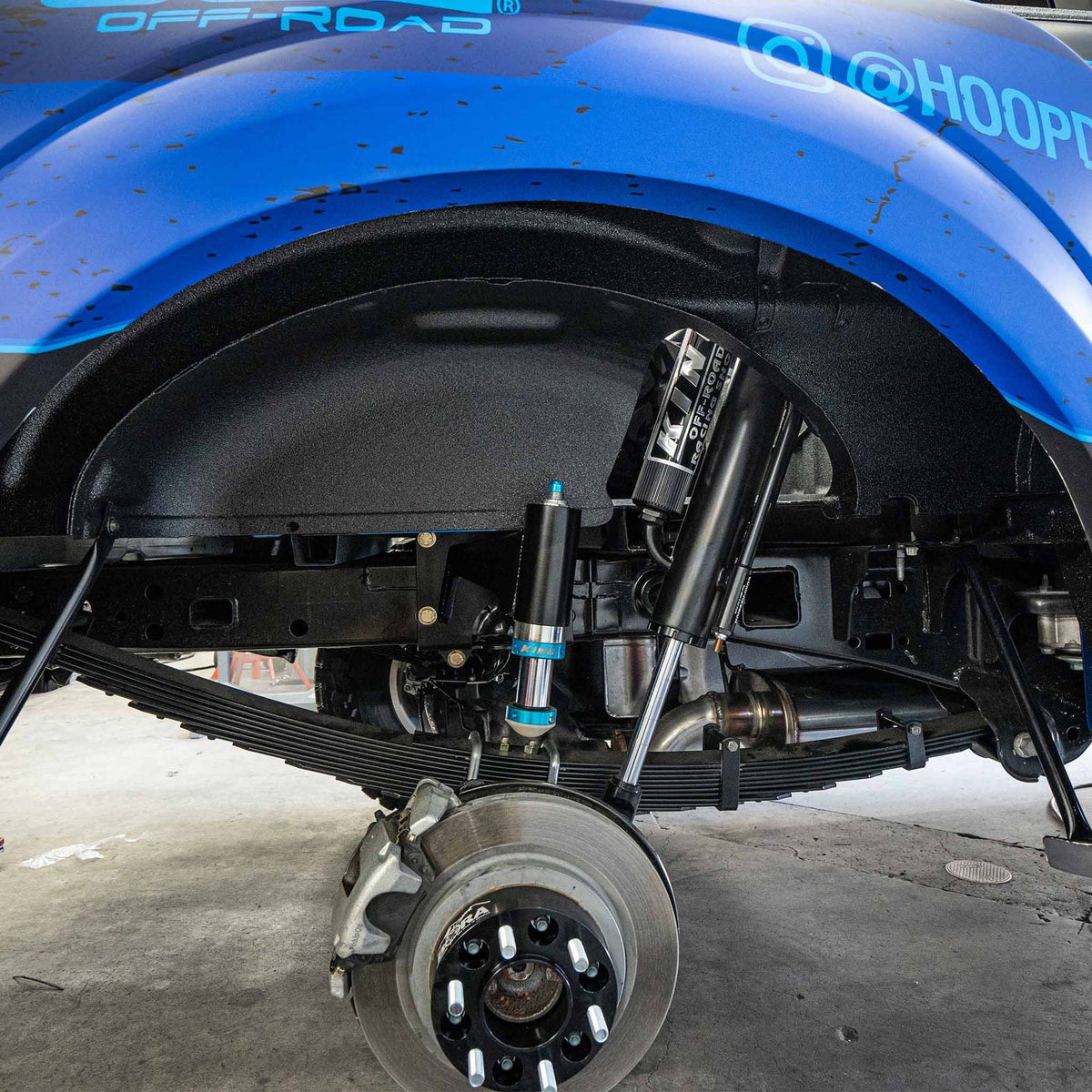 Dirt King bolt-on bump stop kit installed on Ford F-150 – side view