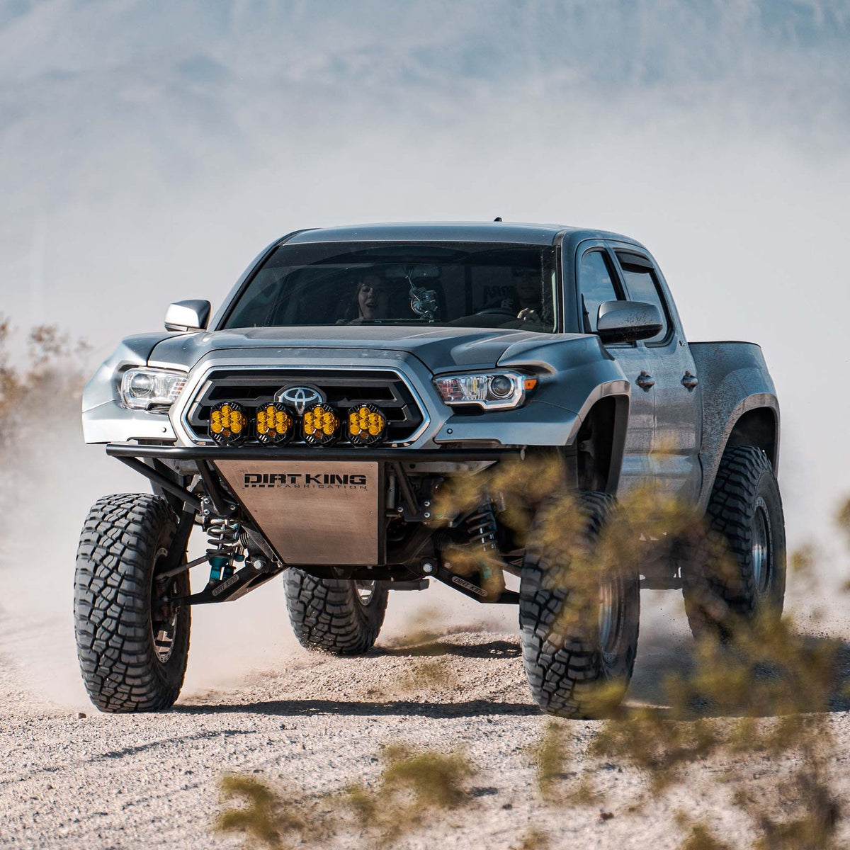 Toyota Tacoma with Dirt King long travel kit — action view