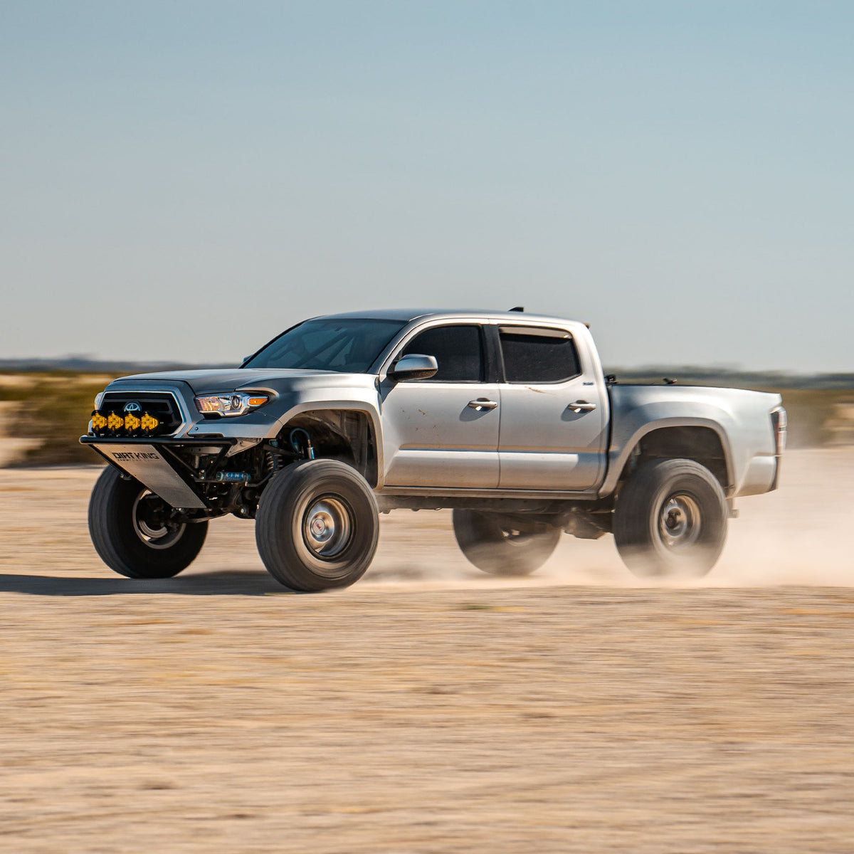 Toyota Tacoma with Dirt King long travel kit — action view 2