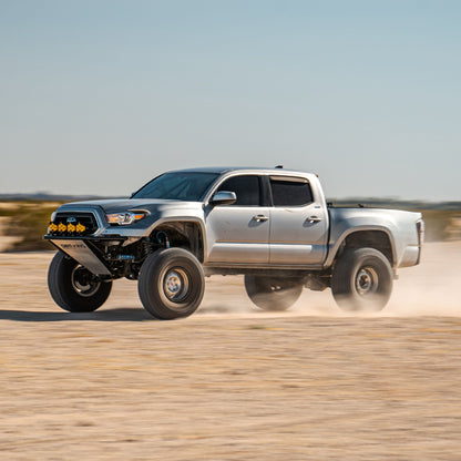 Toyota Tacoma with Dirt King long travel kit — action view 2