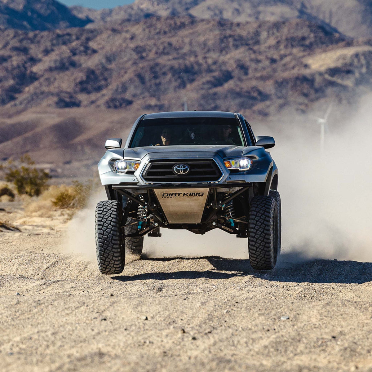 Toyota Tacoma with Dirt King long travel kit — action view 3