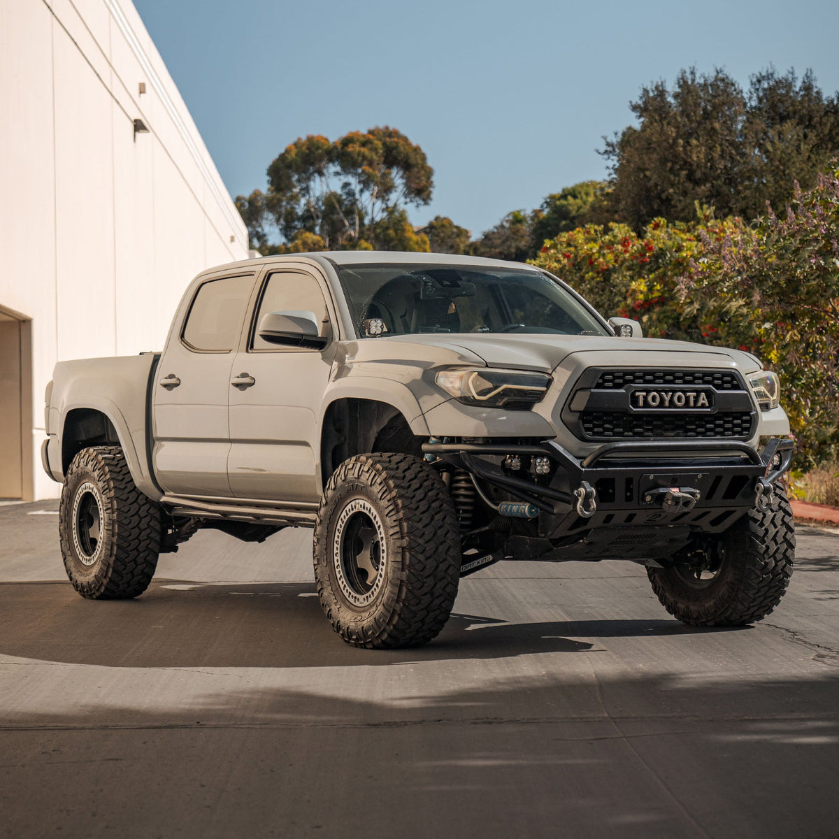 Toyota Tacoma with Dirt King long travel kit — exterior view 2