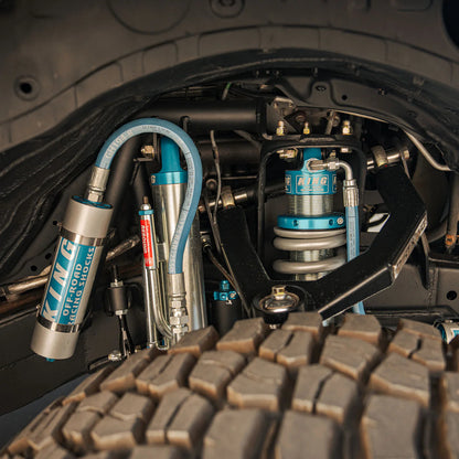 Dirt King Tacoma long travel suspension installed — side view