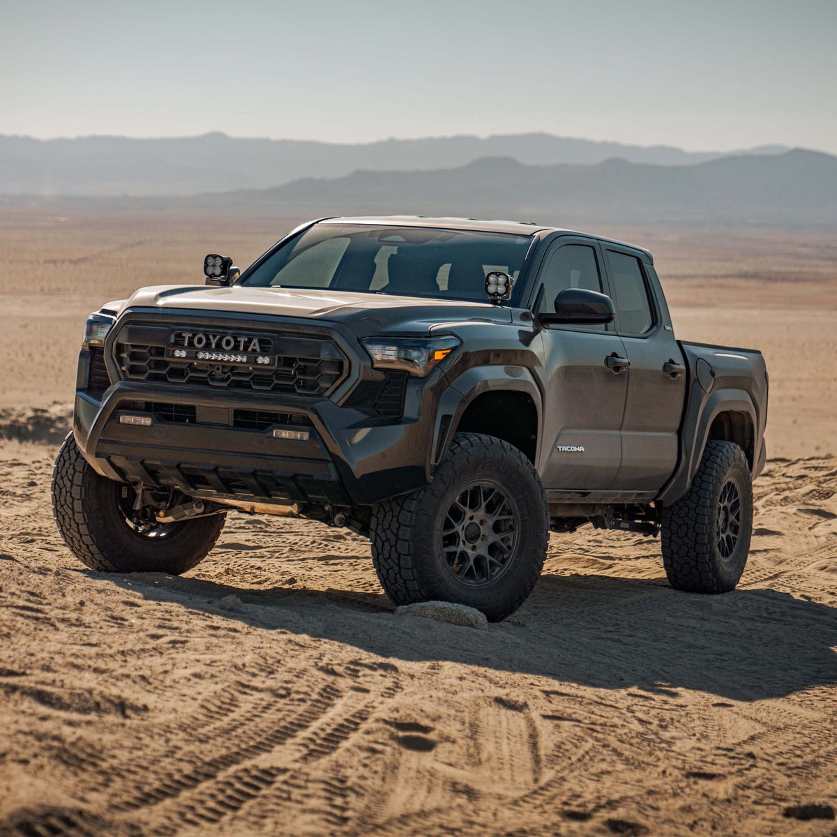 Toyota Tacoma with Dirt King DCA suspension in desert