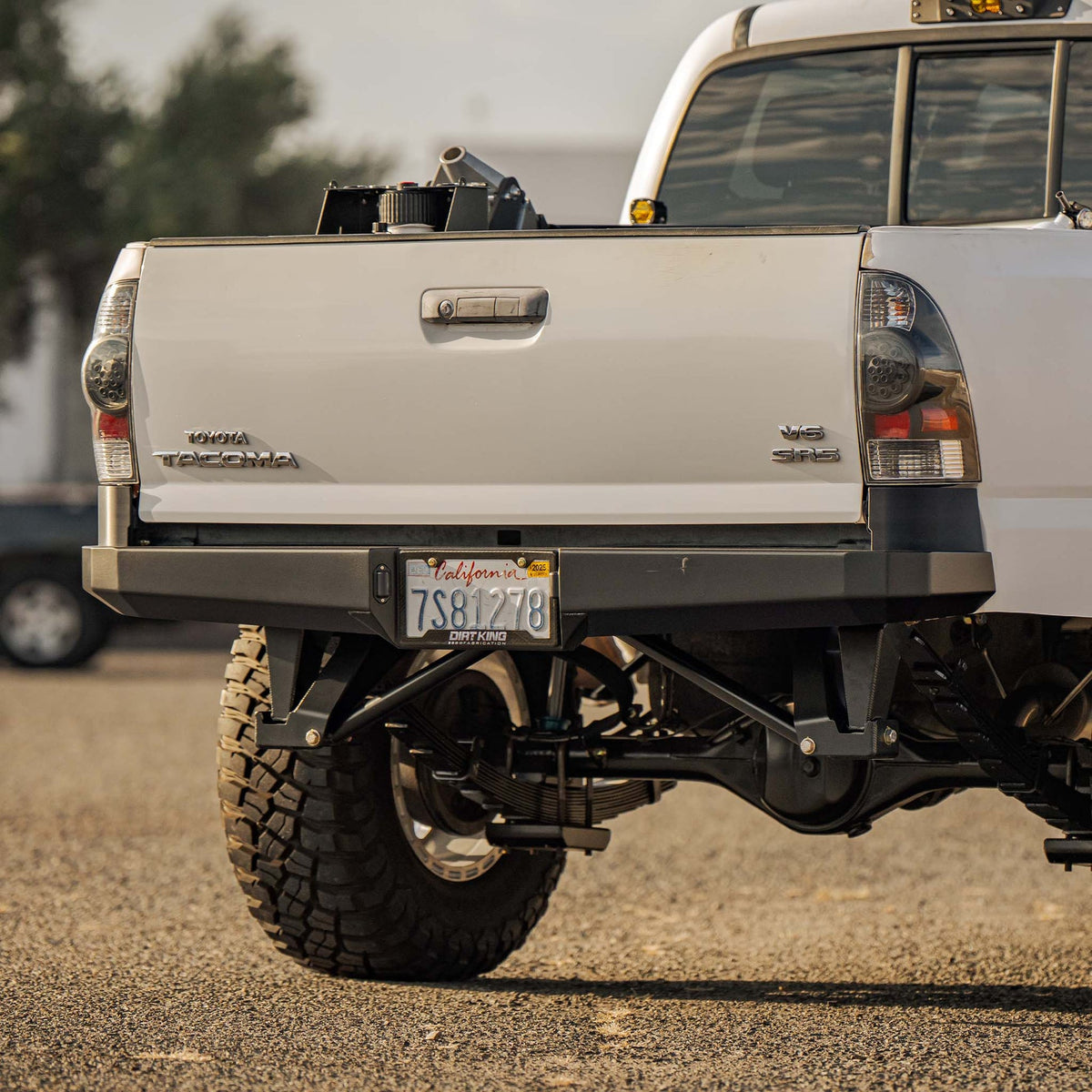 Dirt King plate rear bumper installed angle view on Toyota Tacoma