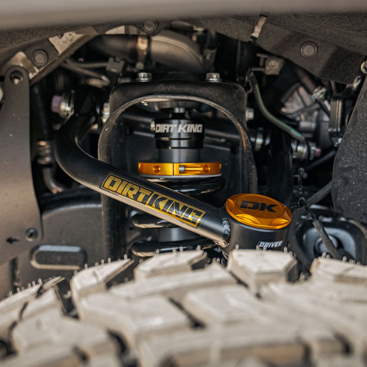 Dirt King 4130 upper control arm installed on Toyota Tundra — suspension view